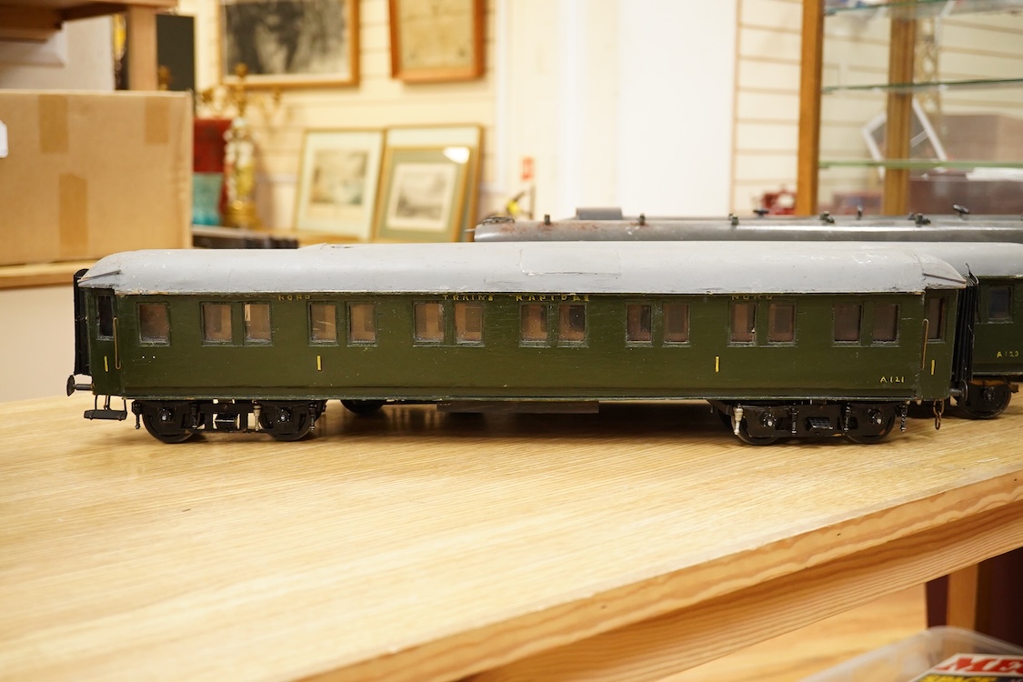 Four Gauge One Continental bogie coaches; two in very dark Green livery, and two ‘Trains Rapides Nord’ in dark green, including some scratch building and possible adaptation from kits